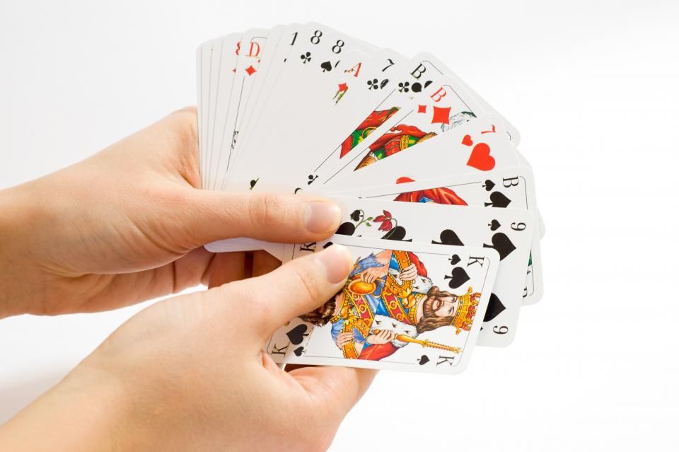 Gaming chips and cards on the table felt