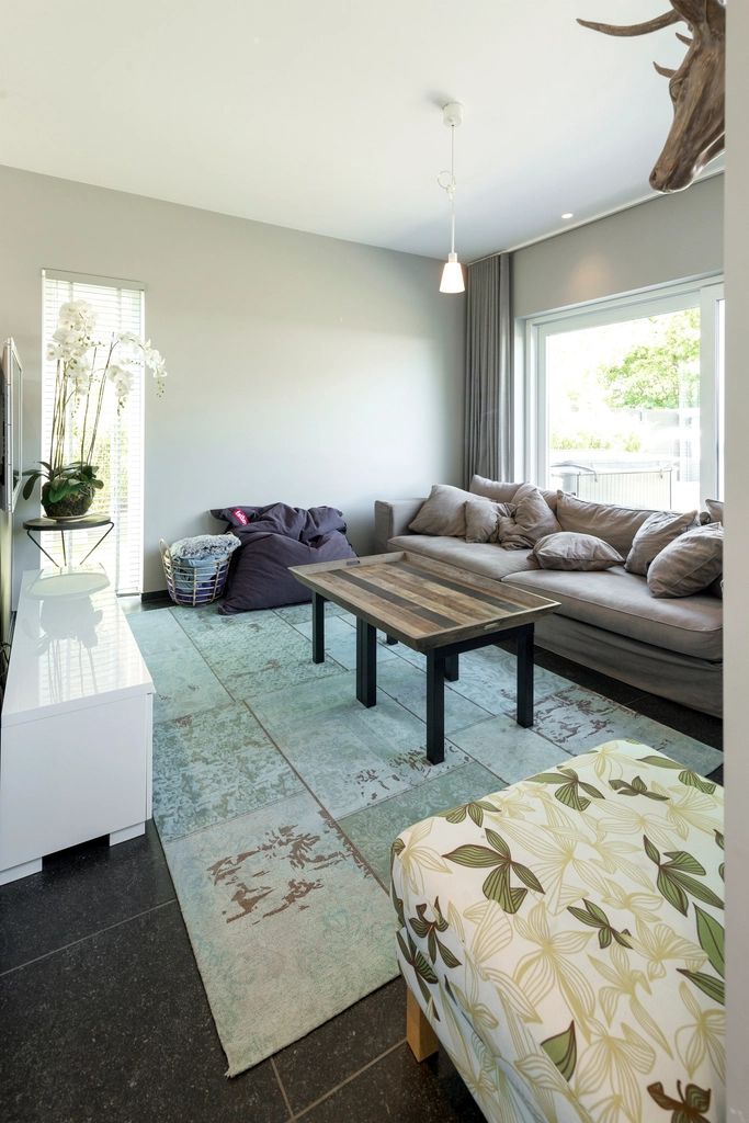 A suite sitting room with a sofa and armchairs